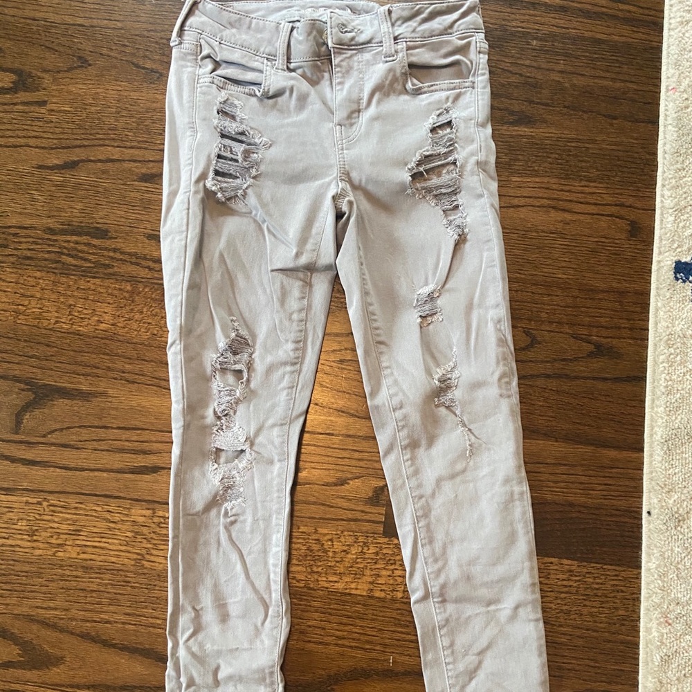 Grey ripped skinny jeans